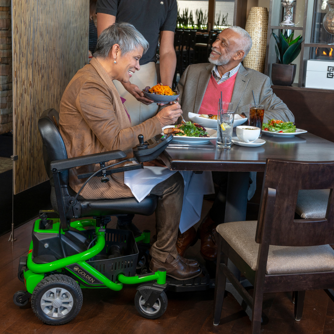 Golden LiteRider Envy Green with person at a table