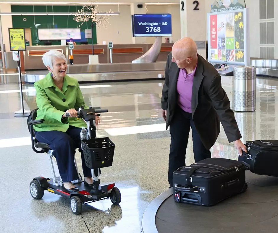 Buzzaround CarryOn Velvet Red Woman riding in Airport