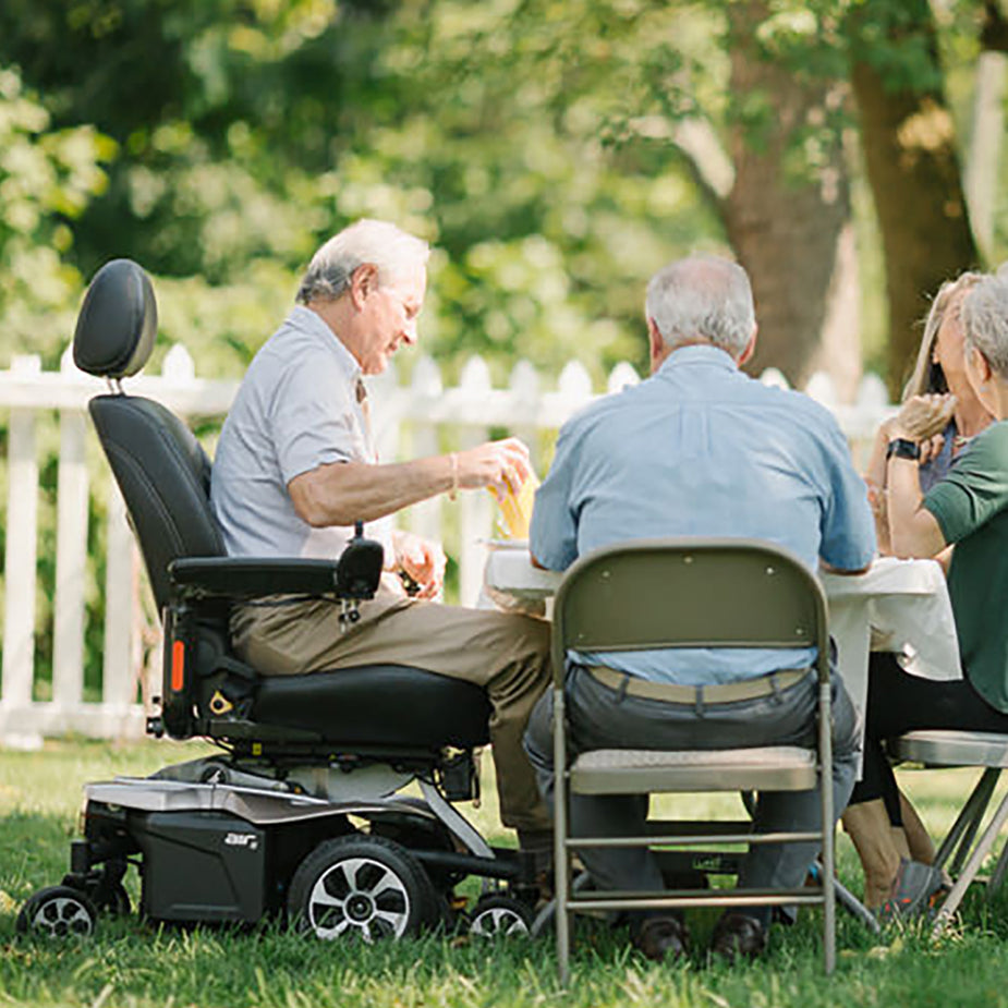 Jazzy Air 2 Lifestyle Photo with Man at a card table