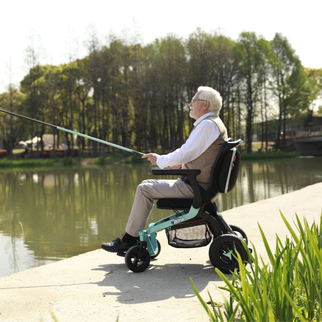 Golden Ally Power Wheelchair Teal with man fishing